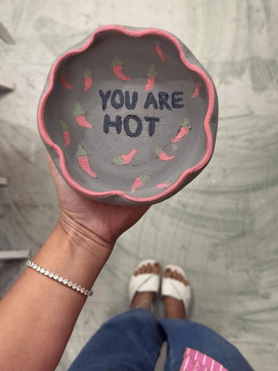 A hand-painted plate that says “You are hot”